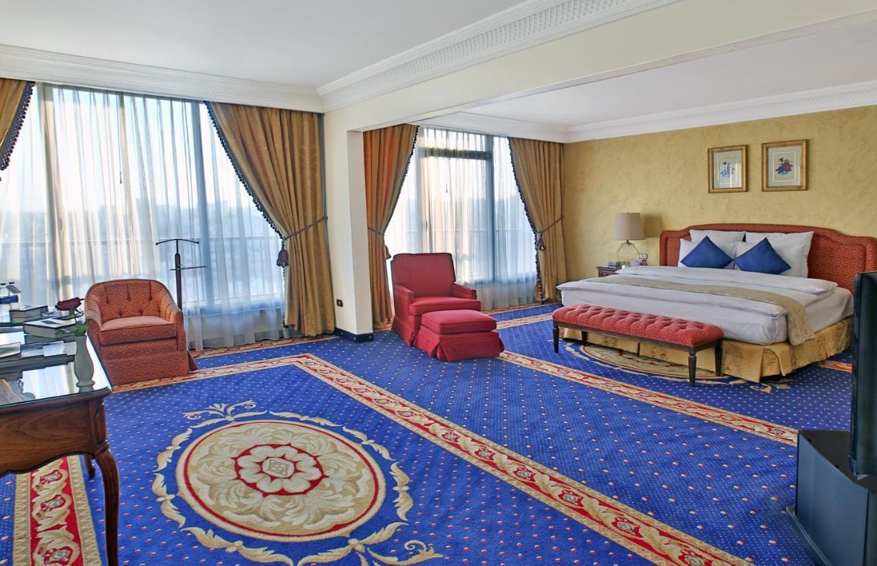Regency Palace Amman Bagian luar foto A bedroom at the Grand Hotel